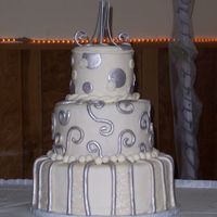 Silver And White Wedding 3 tiers-14, 10, 6 red velvet covered in buttercream and mmf. Mmf accents painted withnu silver
