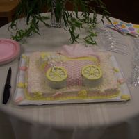 Baby Carriage 1/2 sheet cake topped with baby carriage cake covered in buttercream and mmf