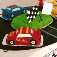 Race Cars This was done for a birthday party for three boys. Each one had their own car and the grass in the middle was for extra cake.