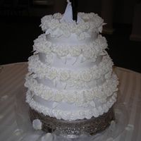 50Th Wedding Anniversary 4-tier stacked b/c with royal icing roses for adornment.