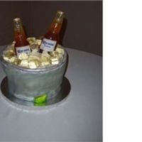 Sugar Corona Grooms Cake Chocolate cake with sugar ice cubes and coronas with edible image labels.