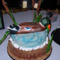 Mallard Duck Completely edible with exception of skewers in cattails. Made of rice paper, fondant, gumpaste, and rice krispie treats.