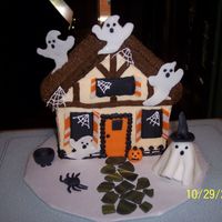 Haunted House This cake was decorated to match the home of the lady who ordered the cake and decorated with a spooky twist for a Halloween Block Party....
