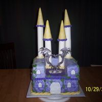 Angels_Wedding_Cake_022.jpg This is a wedding cake that was custom made for a Medieval themed wedding. At the bride and grooms request, the bottom layer is German...