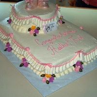 Heather's Baby Shower I cut the top of the photo off with my camera. Chocolate cake butter icing. Booties are sugar as well as the flowers.