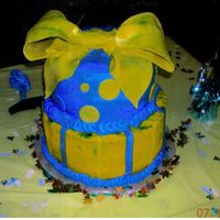 First Baby Shower this ais a cake i made for my niece, she wanted yellow and blue and i thought the big bow would be fun, this was my biggest bow so far. i...