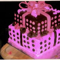 Poka Dots Pink And Brown 1st tier strawberry cake with buttercream,top layer is choc cake with choc frosting and fondant accents. I whipped the buttercream really...