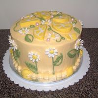 Cake Based On The Lemon White vanilla buttercake filled with custard mousseline and iced with a SMBC. Fondant ACCENTS.