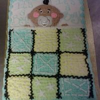 Baby In A Blankie! half vanilla half chocolate cake with buttercreme icing. Design inspired by cakery..thanks!!!