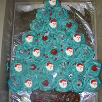 Cupcake Christmas Tree Inspired by all of the other Christmas cupcake cakes I've seen on here, I did this for my sons 1st grade class. He helped me decorate...