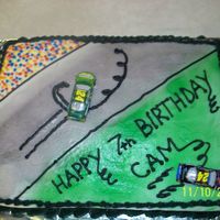 My Sons 7Th Birthday Cake Another year, another race car cake for little man. He wanted the race track cake with his favorite driver doing a burnout. All buttercream...