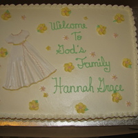 Baby Girl Baptism Cake Vanilla cake with mixed fruit filling. Frosting is a creamy melt in the mouth icing with a hint of lemon flavour. Baby christening gown is...