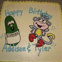 Larry The Cucumber From Veggie Tales Meets Boots From Dora The Explorer Color-Flo cake toppers