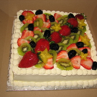 Fruit And Cream Second cake this week using fresh cut fruit. Cake is white sponge, stabilized sweetened whipped cream frosting, cooked custard filling.