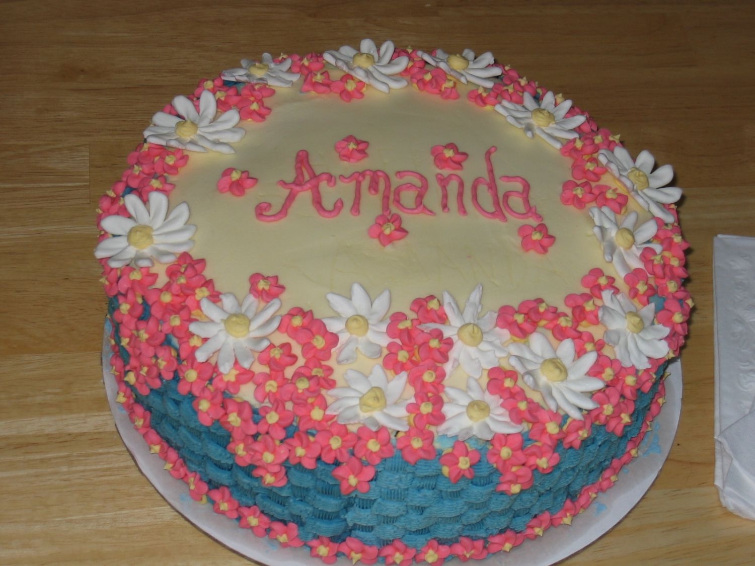 Floral Birthday This is one of the first cakes I ever made. The flowers are royal icing (much easier to work with than buttercream but not nearly as tasty...