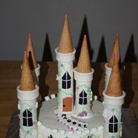 Castle Cake This cake was inspired by Carol Deacon and a few others seen on this site. Made for my daughters 3rd birthday at Chuck E Cheese -a lady who...