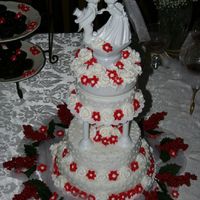 Christmas Wedding Cake Buttercream roses and royal icing drop flowers. Made for a wedding shower for friends getting married out of state. You cant tell in the...