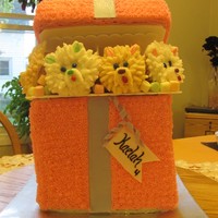 Package For Kaelah Four puppy cupcakes all buttercream. Buttercream package, three tiered then a topper. Fondant bow, ribbon as well as name tag.