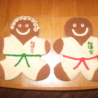 Mr. And Mrs. Wado Kai For our holiday karate party made a boy and a girl gingerbread person in a gi with our styly written on it. All icing is buttercream.