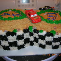 Cars Race Car Track Cars race car track the cake was done in the checkerboard pattern when you cut it open