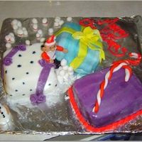 Santa's Presents This cake was just a white cake filled with oreo pudding. I used fondant with rum flavoring and buttercream frosting.