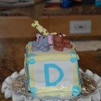Baby Block Cake Baby Block Cake covered with fondant and fondant accents. The animals on top are fondant/gumpaste. There are some obvious issues with the...