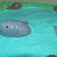 Fish.jpg First attempt at fondant! Inspired by luvtodecorate's fishing cake! TFL