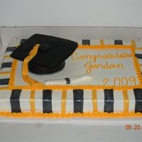 Grad Cake This is the cake I made for my cousin's graduation. I had a lot of trouble with the mortarboard(?). I tried to make it out of fondant...