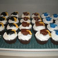 Graduation Cupcakes These were made for a graduation party that was for three different people that were all from different schools. Chocolate cupcakes with...