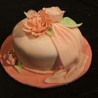 Rich Romance Pink tone on tone with fondant and gum paste fantasy flowers, drape and leaves. This cake was my graduation cake for the new Wilton Fondant...
