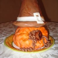 Harvest Cake Pumpkin cake was carved to appear to be laying on it's side, then covered in orange fondant, then sponge painted with color to enhance...