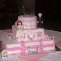 Jill's Wedding Cake This is my first wedding cake! The bride loved it ! Thank goodness! The bottom cake is 12x18x2 the middle is 10x10x2 and the top is 7x2.I...