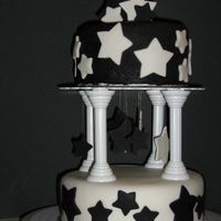 Star Birthday Cake Made for a co-worker who is obsessed with stars and always wears black and white. Cut the star bouquet on top and the dangling stars out of...