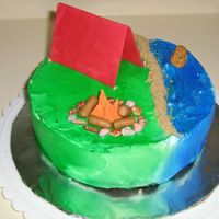 Camping_Cake.jpg Camping cake for my favorite co-worker. It was an idea I had one night when I couldn't sleep (I tend to plan out new cakes when I can...