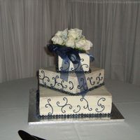 Square Wedding Cake Cake I did for my friend - Butter yellow cake with blueberry jam filling. The trim is fresh blueberries, scrollwork in buttercream. The...