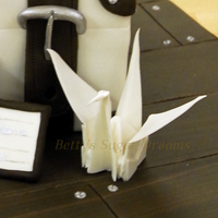 Luggage To Japan Wedding cake for a couple moving to Japan. Everything is made from gumpaste, only the couple is Fimo. Really love how the origami crane...