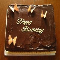 Img_0027.jpg Chocolate sponge with ganache filling and topping, buttercream writing and gumpaste butterflies coloured with lustre dust. For colleague&#...