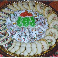 Christmas Cookies Tray Spritz cookies, white chocolate Bric-a-Brac and holly leaf sugar cookies.