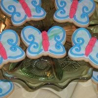 Butterflies Rich rolled sugar cookies with rolled fondant and piped royal icing.