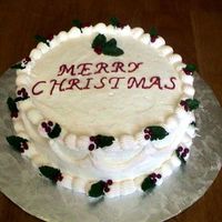 Christmas Cake White cake with strawberry filling and buttercream frosting