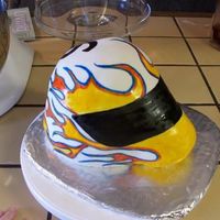Motorcycle Helmet Cake Chocolate cake with ganache filling and covered in MMF. Hand painted.I made this for my brother's friend who loves motorcycles. His...