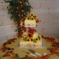 Fall Wedding Cake - Van Gough Theme French vanilla cake with coconut buttercream, strawberry filling 2 tiers and coconut buttercream bana filling head tier Yellow MMF fondant...