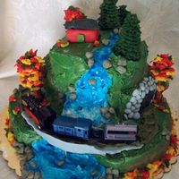 Waterfall With Steam Train This cake was made for my Grandpa who just turned 80. He loves steam trains and used to own a red cabin. The cakes are covered in BC, the...