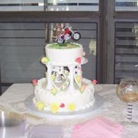 Wedding Cake This is my 1st Wedding cake. It was a white cake with butter cream filling and butter cream icing than covered with fondent.The roses are...