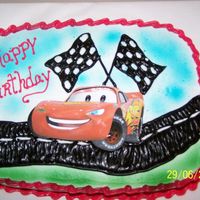 Lighting Mcqueen yellow cake and buttercream icing! the car is a scrapbook picture.because i couldnt fine an edible image.but i think it came out pretty...