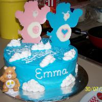 Care Bears marble cake with buttercream icing and the care bears on the top of the cake r chocolate melts.