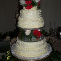 Christmas Eve Wedding Christmas Eve wedding cake, with fresh poinsettas and white roses