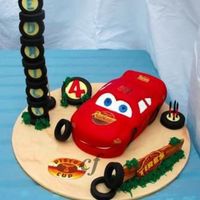 Lightning Maqueen Cake "That cheeky car" made for my sons fourth birthday. The cake was chocolate mud, filled with chocolate ganache and the tyres,...