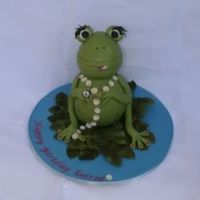 Froggy I made this cake for a 9 year old girl who didn't want it too girly. She also wanted a peace symbol on the cake somewhere, so i gave...