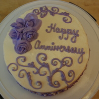 Lavender Anniversary WASC with buttercream frosting, fondant roses, and pearl dragees. Inspired by another cake on here.